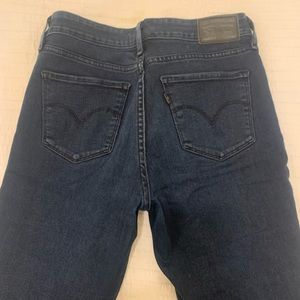 Levi’s 711 skinny jeans size 27, dark blue, frayed hem